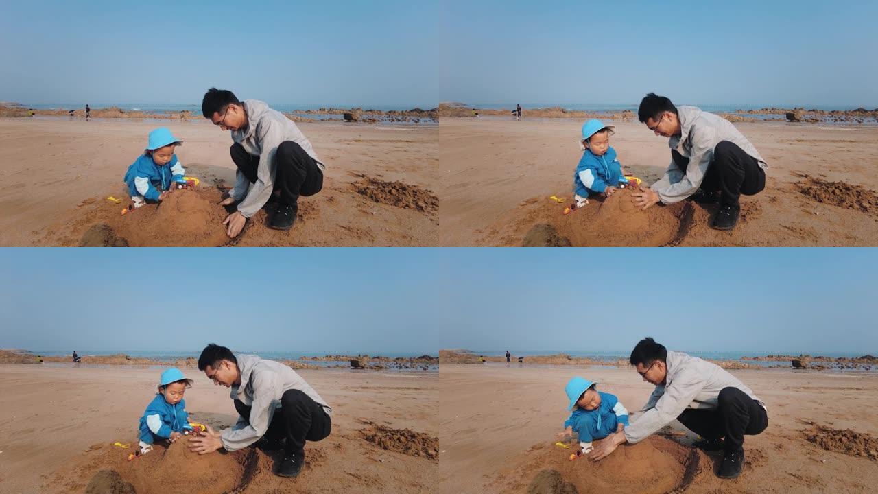 父亲和儿子在海滩上玩沙子