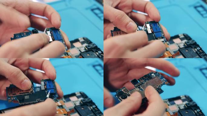 修理工用镊子把微芯片切成碎片。手特写。