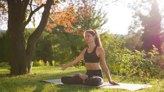 保持健康的生活方式，锻炼身体，在后院户外做瑜伽