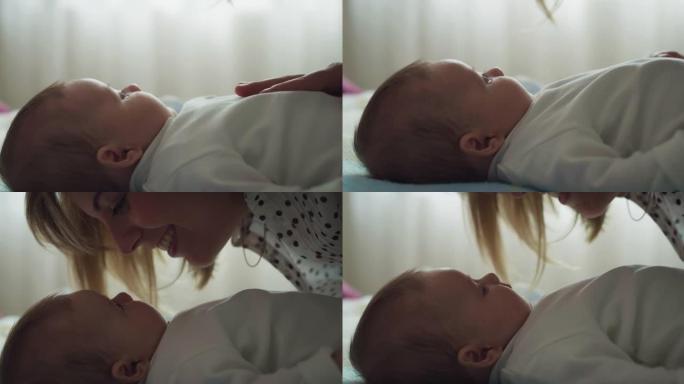 年轻的neo母亲的电影镜头在早晨与她的新生婴儿在托儿所里玩耍。儿童，婴儿，父母身份，童年，生活，爱情