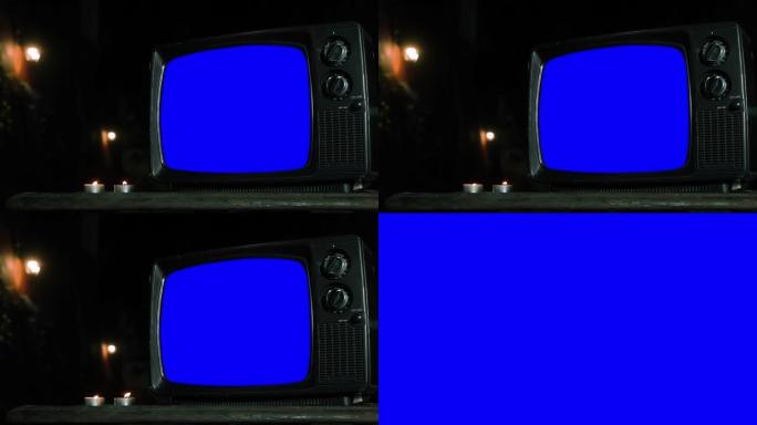 旧电视在晚上打开蓝屏。放大到蓝屏。特写。4k分辨率。