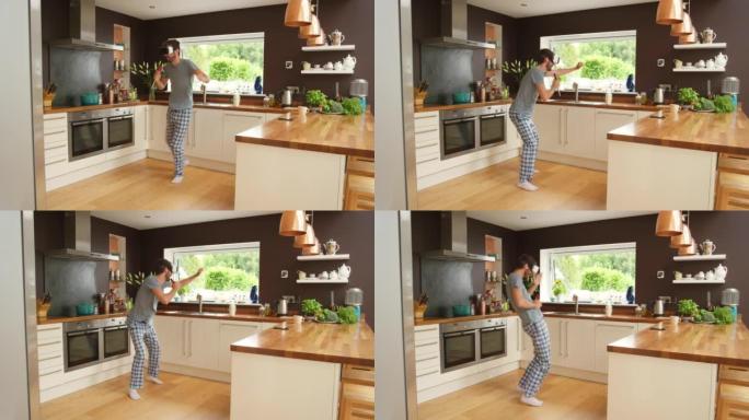 4k视频片段，一名男子戴着VR耳机在厨房里跳舞