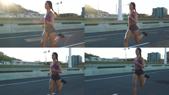 在城市街道上训练的妇女的跑步，健身和跑步者锻炼。健康，强壮和运动运动员的运动动机和重点在城市道路上锻