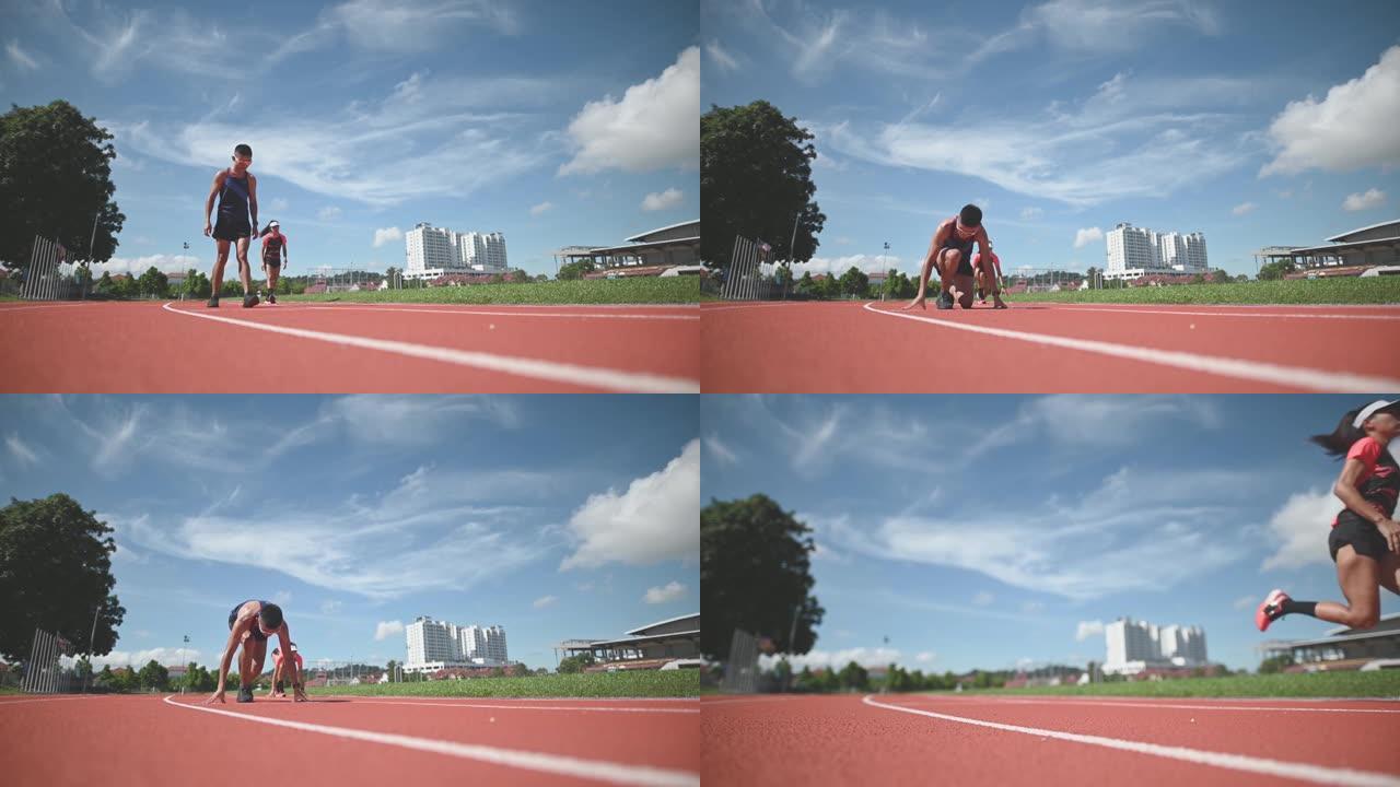 空气动力学亚洲中国女男运动员在跑道上冲刺，并在田径场上冲向终点线