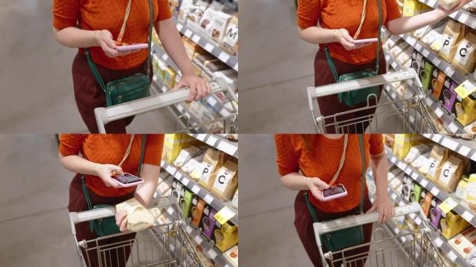 女人在超市购物时使用电话