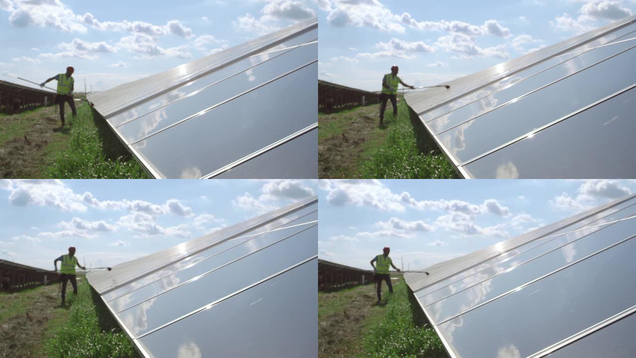 男性工人清洗太阳能电池板