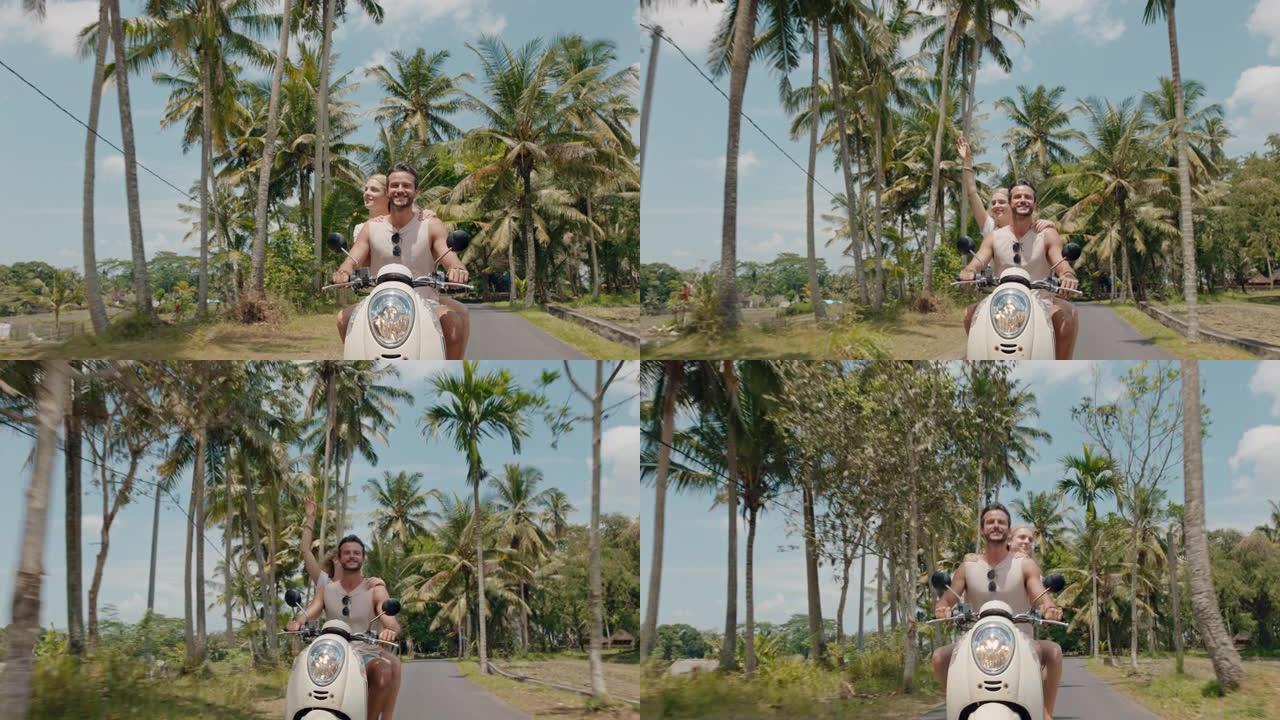 旅行情侣骑滑板车在热带岛屿上快乐的女人举起手臂庆祝享受有趣的假期公路旅行和男朋友骑摩托车