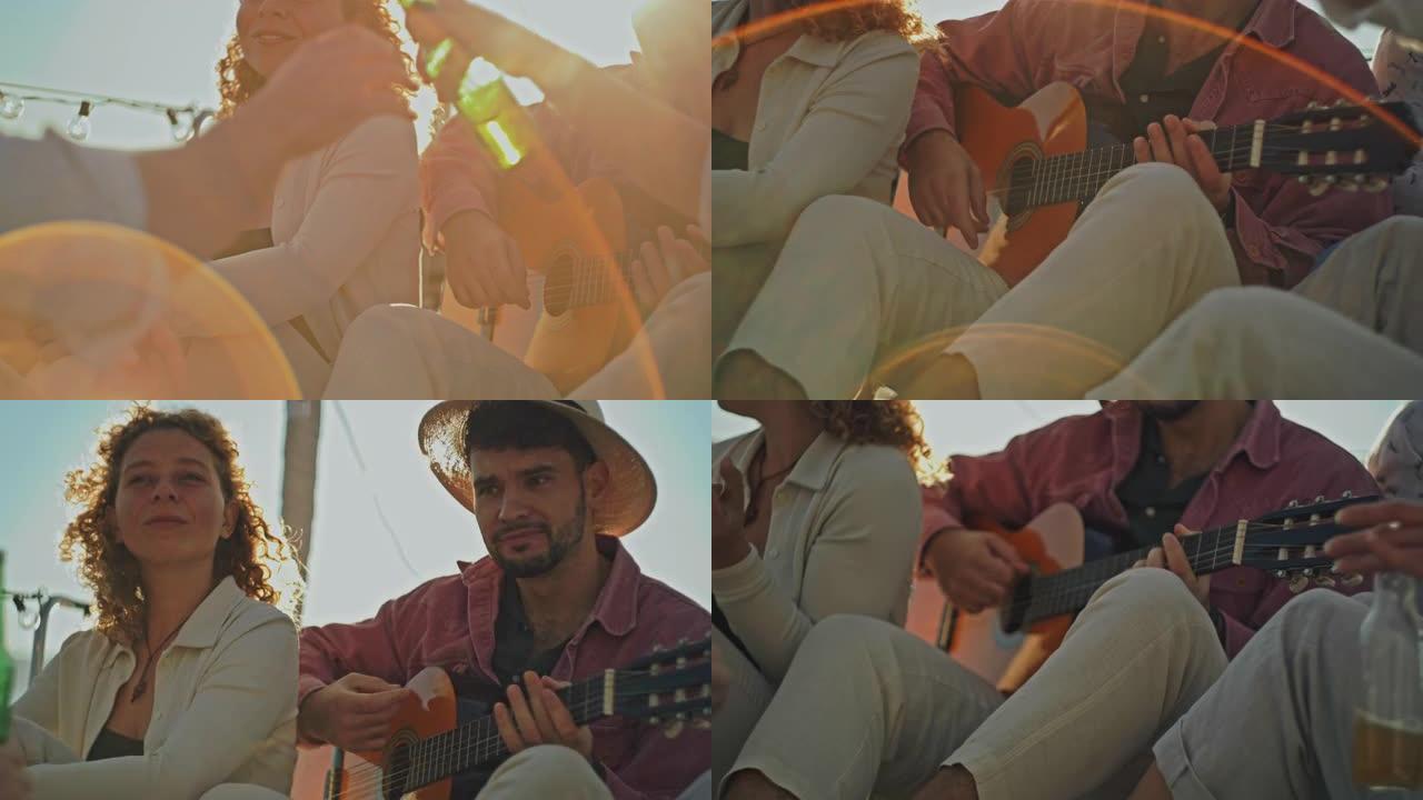 SLO MO Man在日落时在船上举行聚会时向他的朋友弹吉他