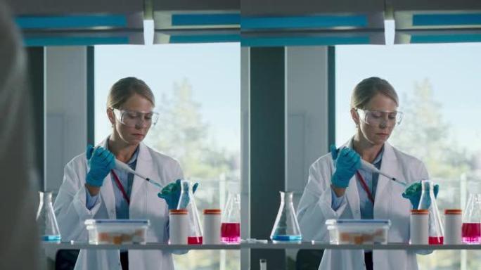垂直视频: 美丽的女医学家穿着白大褂和安全眼镜，在检查样品时使用微量移液器。创新、实验药物研究、实验