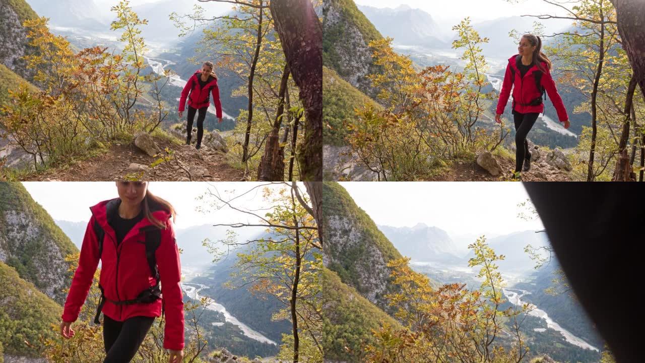 女徒步旅行者在风景令人难以置信的群山中上山行走