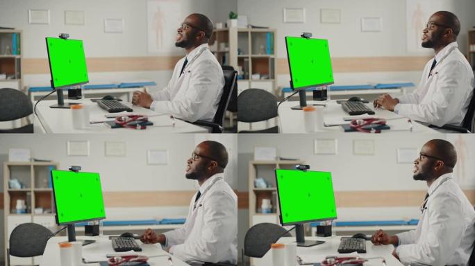医生在线医疗咨询:非裔美国医生正在绿屏电脑上进行视频会议。医护人员向病人解释检查结果。