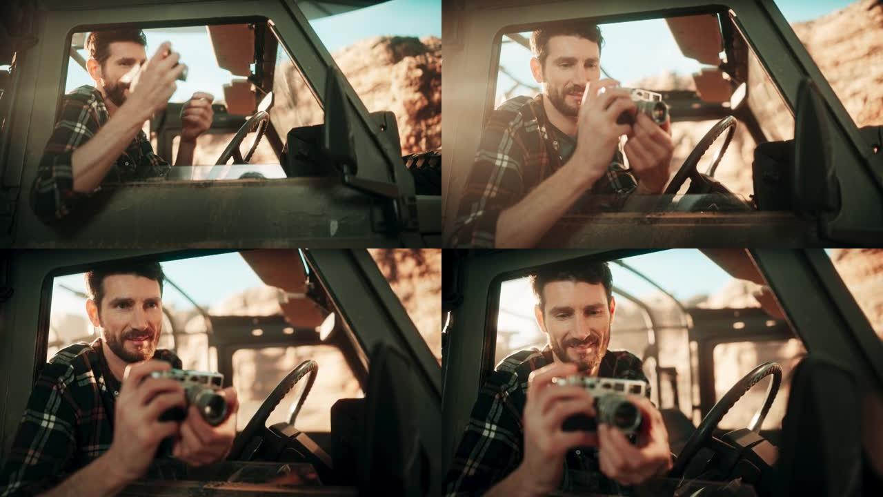 沙漠之旅: 专业旅行男摄影师的肖像使用相机，通过汽车的侧窗拍照。越野越野车穿越岩石峡谷。记录惊人的自