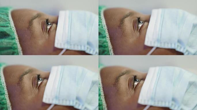 一名妇女在手术室进行眼科手术的特写镜头