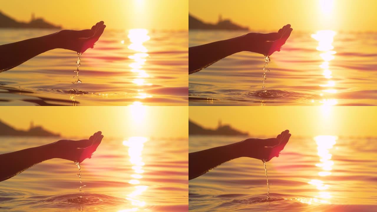 特写: 度假的女游客在日出时举起少量海水。