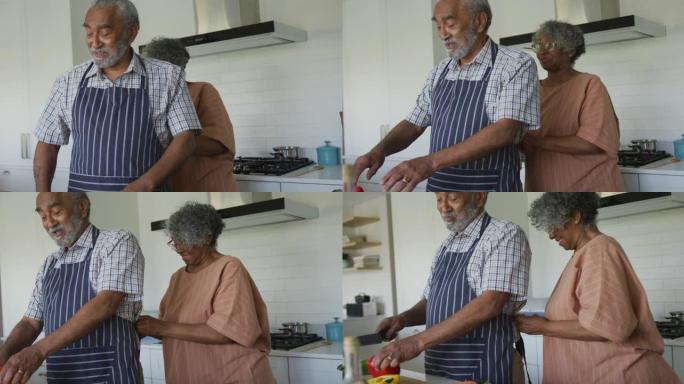 快乐的非洲裔美国老年夫妇在厨房一起做饭的动画