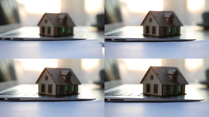 笔记本电脑上的房屋模型