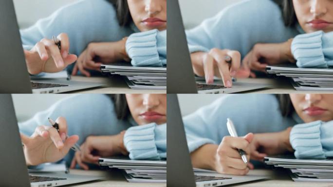 疲惫的学生与笔记本电脑和书籍悲伤的写作质量，研究问题或文案在书桌上。女人在学习或写文章时上网寻找灵感