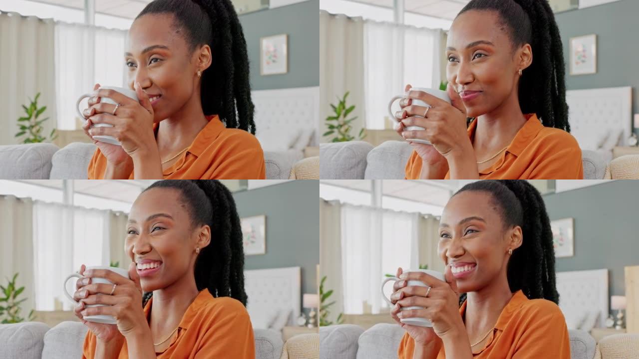 黑人妇女喝杯咖啡，在沙发上微笑放松或在家里休息。年轻的非洲裔美国女士，在客厅里平静地闻到茶或热巧克力