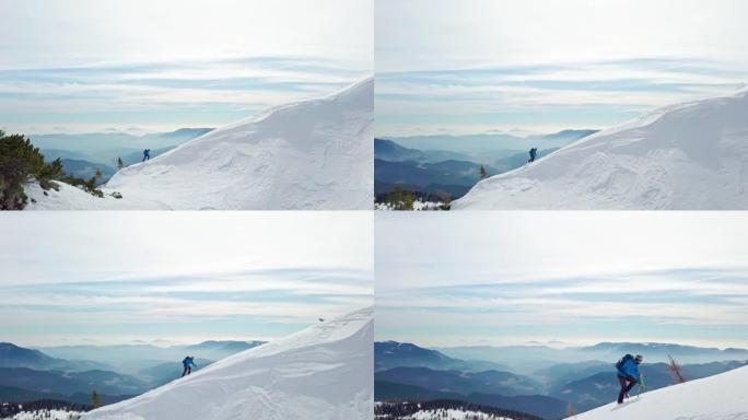 男子用冰斧爬上雪山斜坡