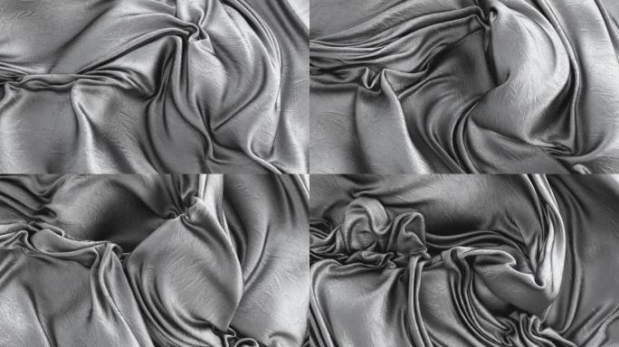 抽象金属箔毯。银灰色布料丝绸绸缎柔软光滑