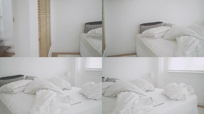 用枕头和毯子平移白色卧室