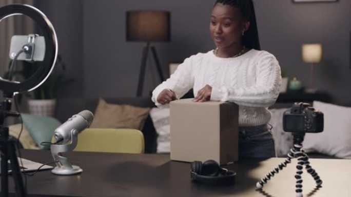 4k视频片段，一名年轻女子记录自己在家里打开箱子的包装