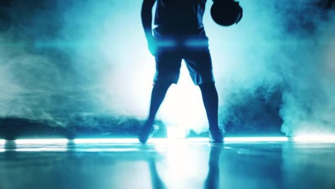 运动员在黑暗中练习篮球