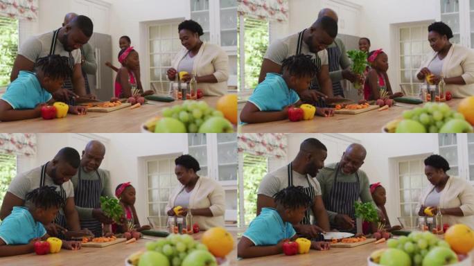 三代非洲裔美国家庭在家里的厨房里一起工作