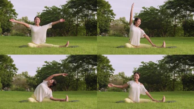 亚洲瑜伽女子在公园景观中做瑜伽