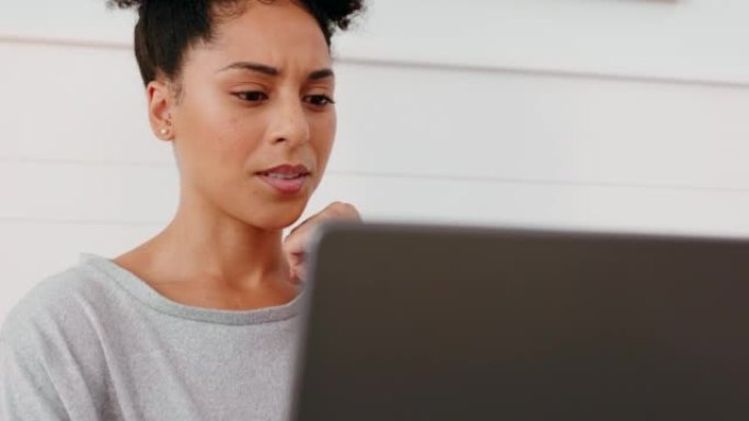 笔记本电脑，与一位在她的小企业在家工作的黑人女性企业家感到困惑和思考。计算机，怀疑和想法与女性员工在