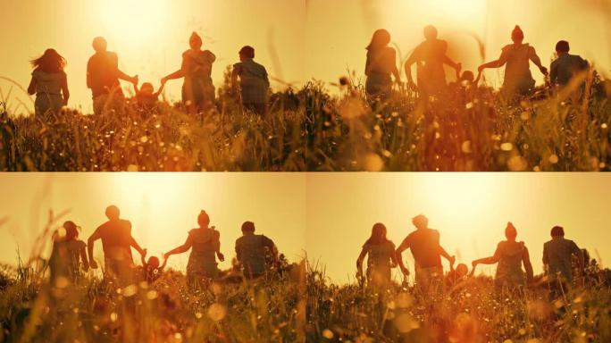 有三个孩子的时间扭曲家庭在日落时在高草丛中奔跑的乐趣