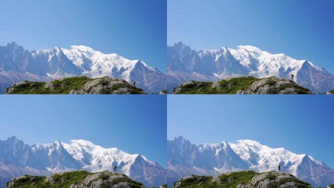 男子徒步旅行者在山上徒步旅行。勃朗峰背景