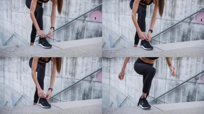 身体意识强的女人在运动鞋上系鞋带，准备锻炼
