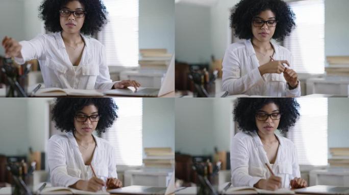 4k视频片段，一位有吸引力的年轻女学生使用笔记本电脑在家学习