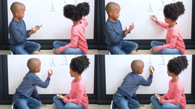 两个非裔美国孩子在白板上做数学