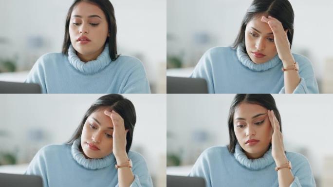 在笔记本电脑上工作的商务女性会感到精疲力竭、压力和头痛。心理健康，焦虑和悲伤的员工忙于在线，而在办公