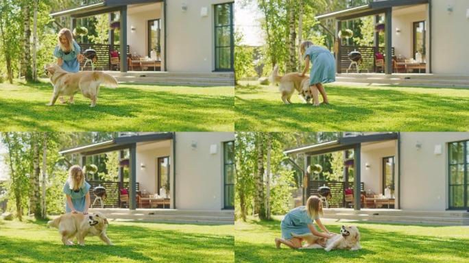 可爱的女孩和快乐的金毛猎犬在后院草坪上玩得很开心。她宠物，玩耍，在地上解决它，并抓伤肚子。血统狗在下