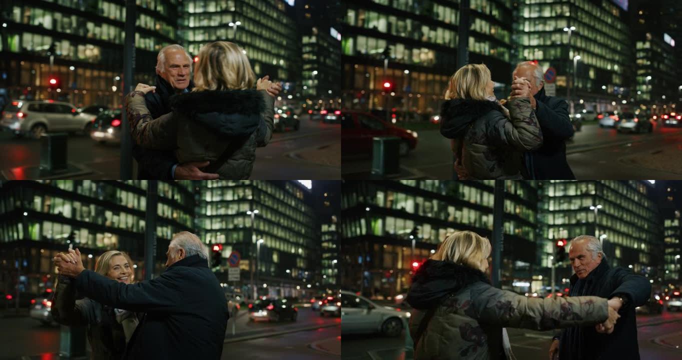 可爱的高级夫妇的特写镜头正在晚上在市中心跳舞庆祝他们永远的爱。