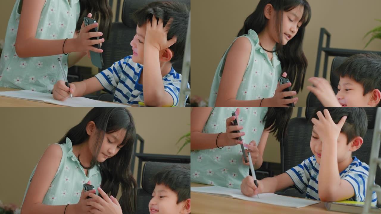 特写姐姐在手机上展示作业教学哥哥做作业。家庭教育概念。家庭学校