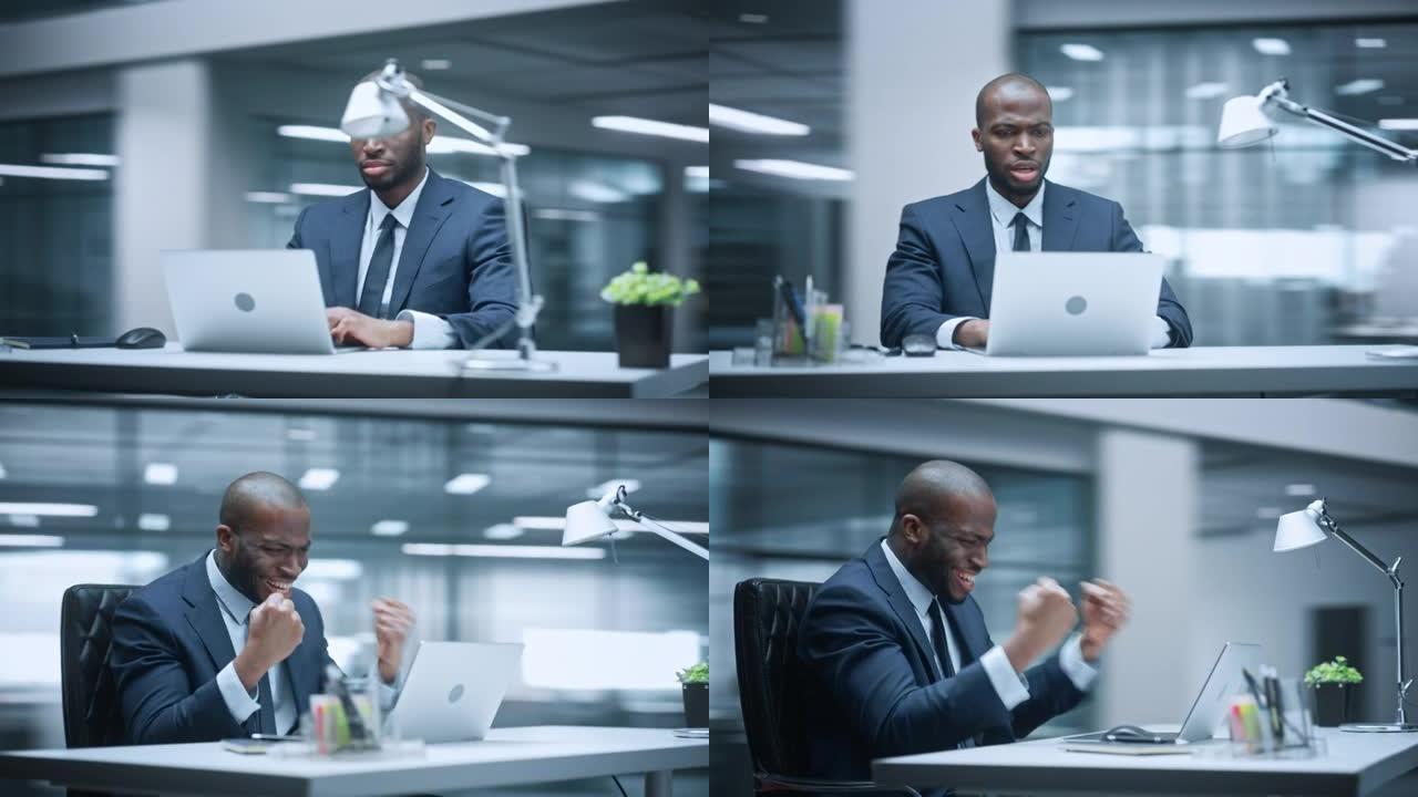 360学位办公室: 商人坐在办公桌前在笔记本电脑上工作，在情感上庆祝电子商务交易的成功。企业企业家在