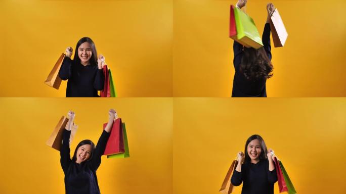 年轻的亚洲妇女背着黄色背景的购物袋