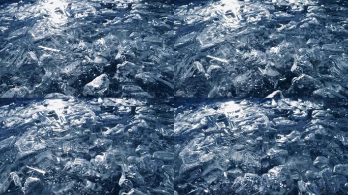 冰冻河流宏观拍摄。异想天开的冰纹。太阳从冰面反射出来。滑动高质量镜头，UHD