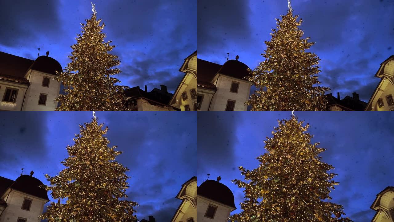 圣诞节前夕装饰的圣诞树在夜晚的城市中照亮