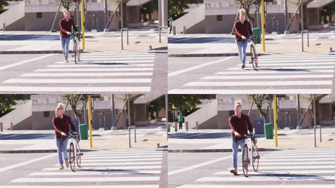 白化非裔美国男子，长发lock骑着自行车穿越道路