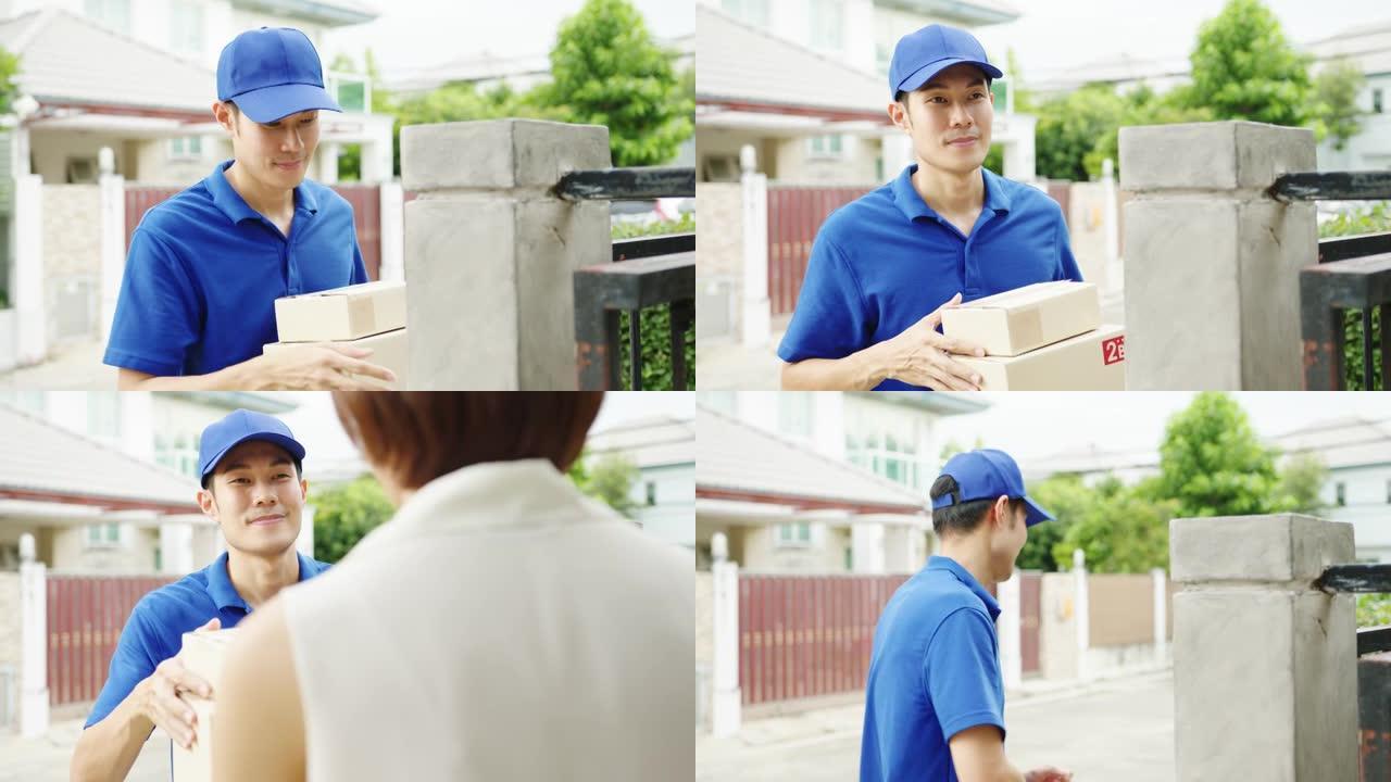 年轻的亚洲邮政快递快递员，穿着蓝色衬衫，处理包裹，在家中发送给客户，亚洲女性在户外接收包裹。