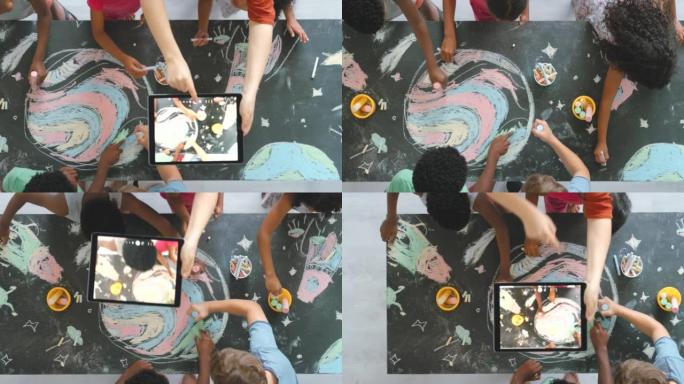 有趣，有创意和教育意义的孩子在教室里画画活动，老师在平板电脑上拍照。儿童自愿参加一个丰富多彩的艺术项