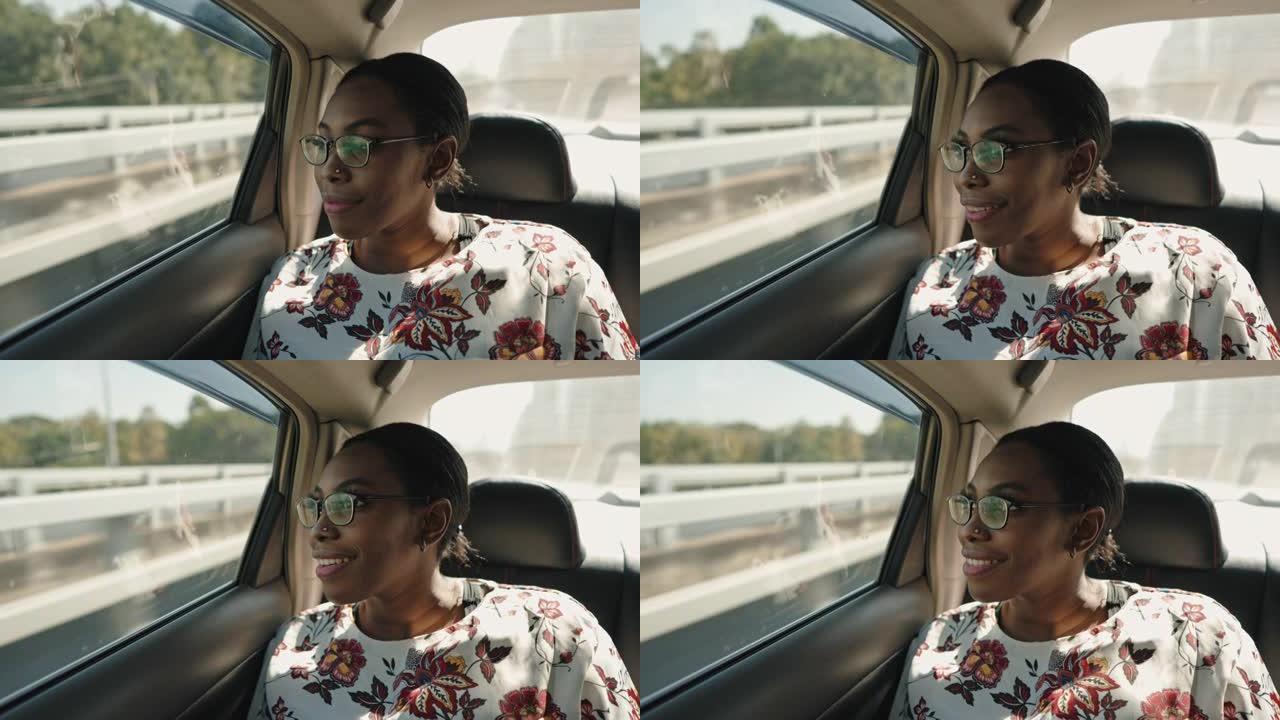 车里微笑的女人黑人女孩放松旅行