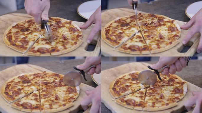 一个无法识别的男人切披萨的4k视频片段