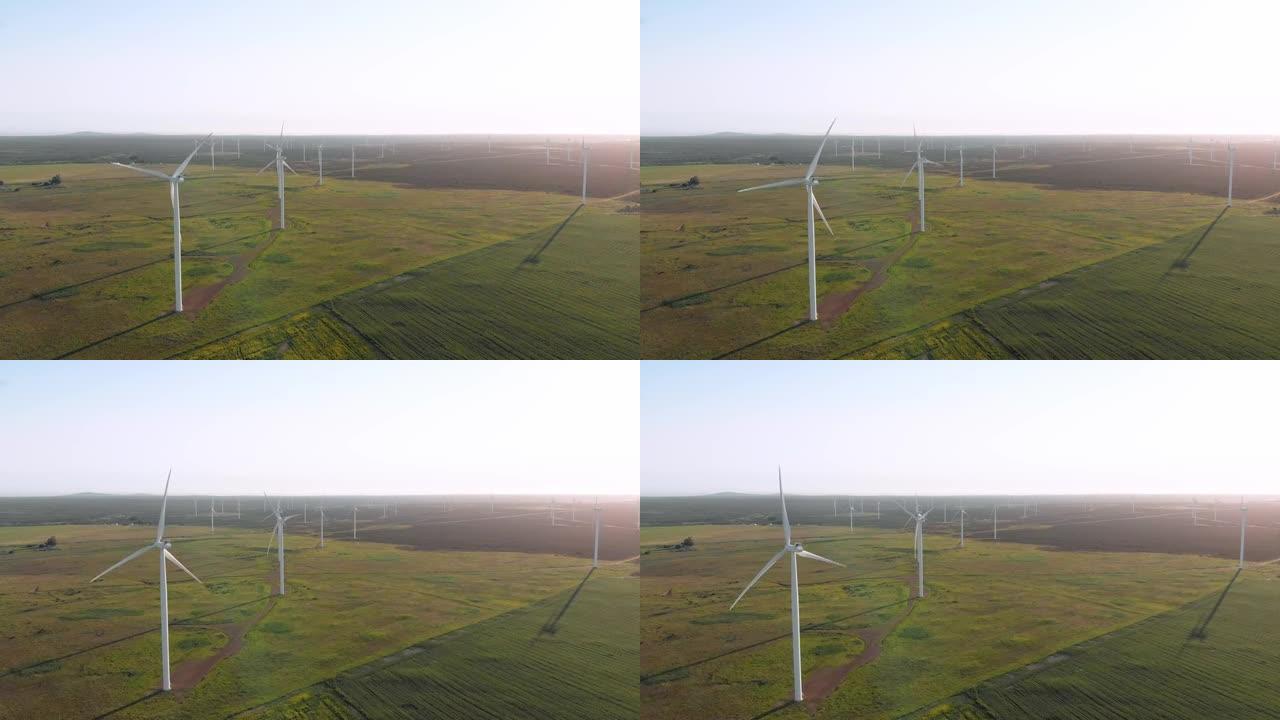 无云天空乡村景观中风力涡轮机的总体视图
