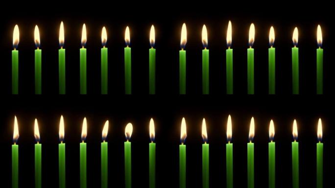 绿色蜡烛在黑暗中燃烧